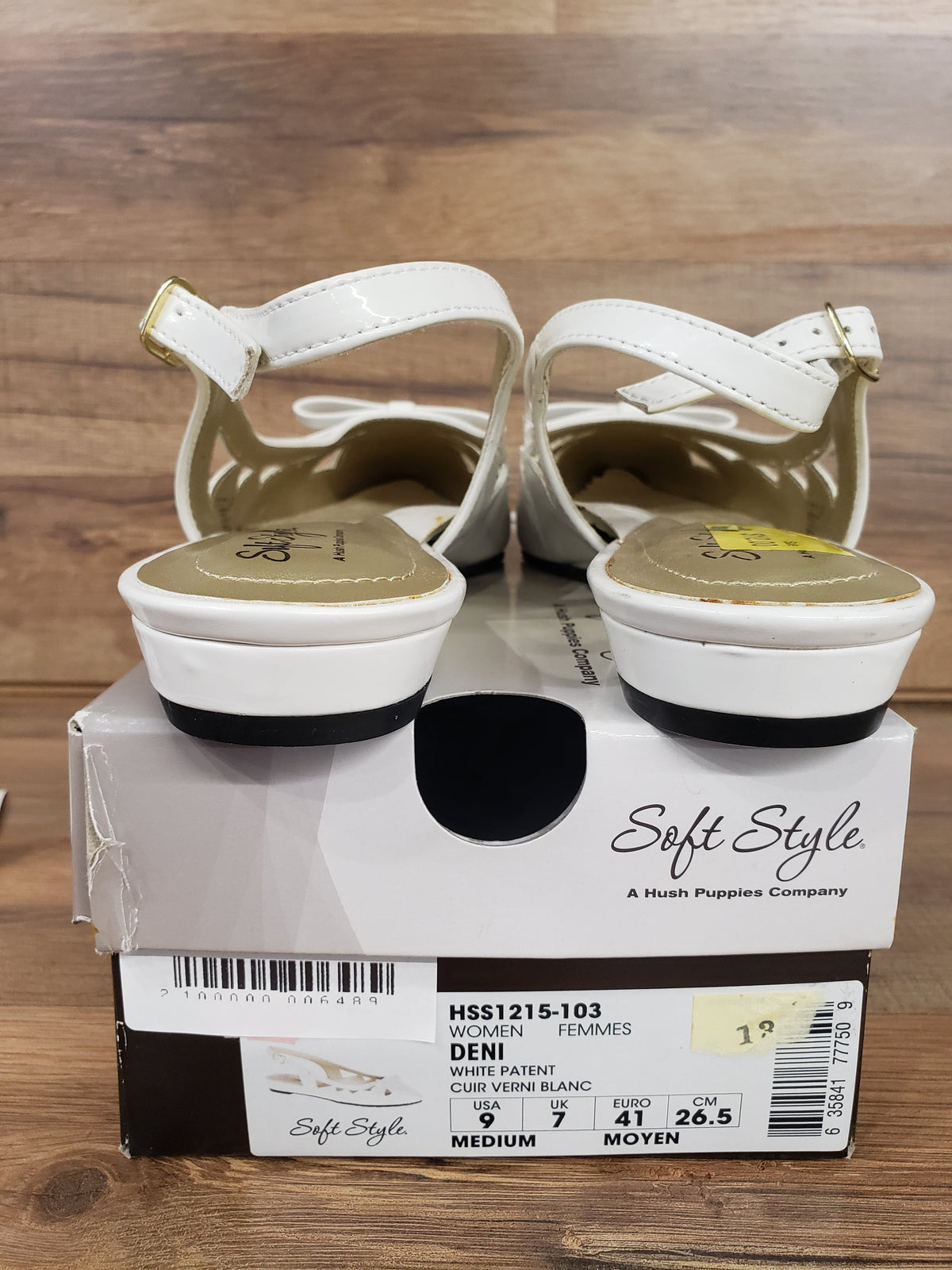 Allen's Bootery Soft Style by Hush Puppies Deni white patent slingback flats with gold buckles on a shoe box