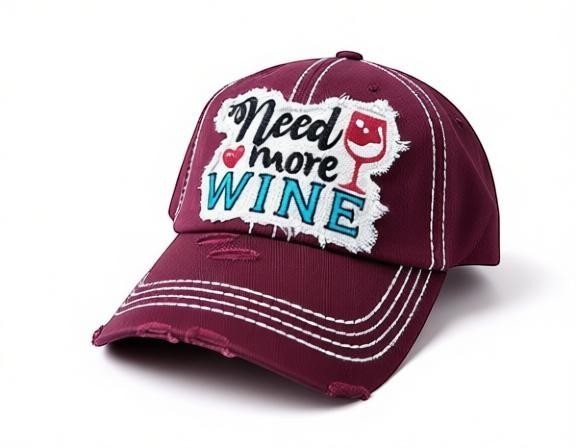 Allen's Bootery burgundy distressed cotton baseball cap with Need More Wine embroidered patch and white stitching