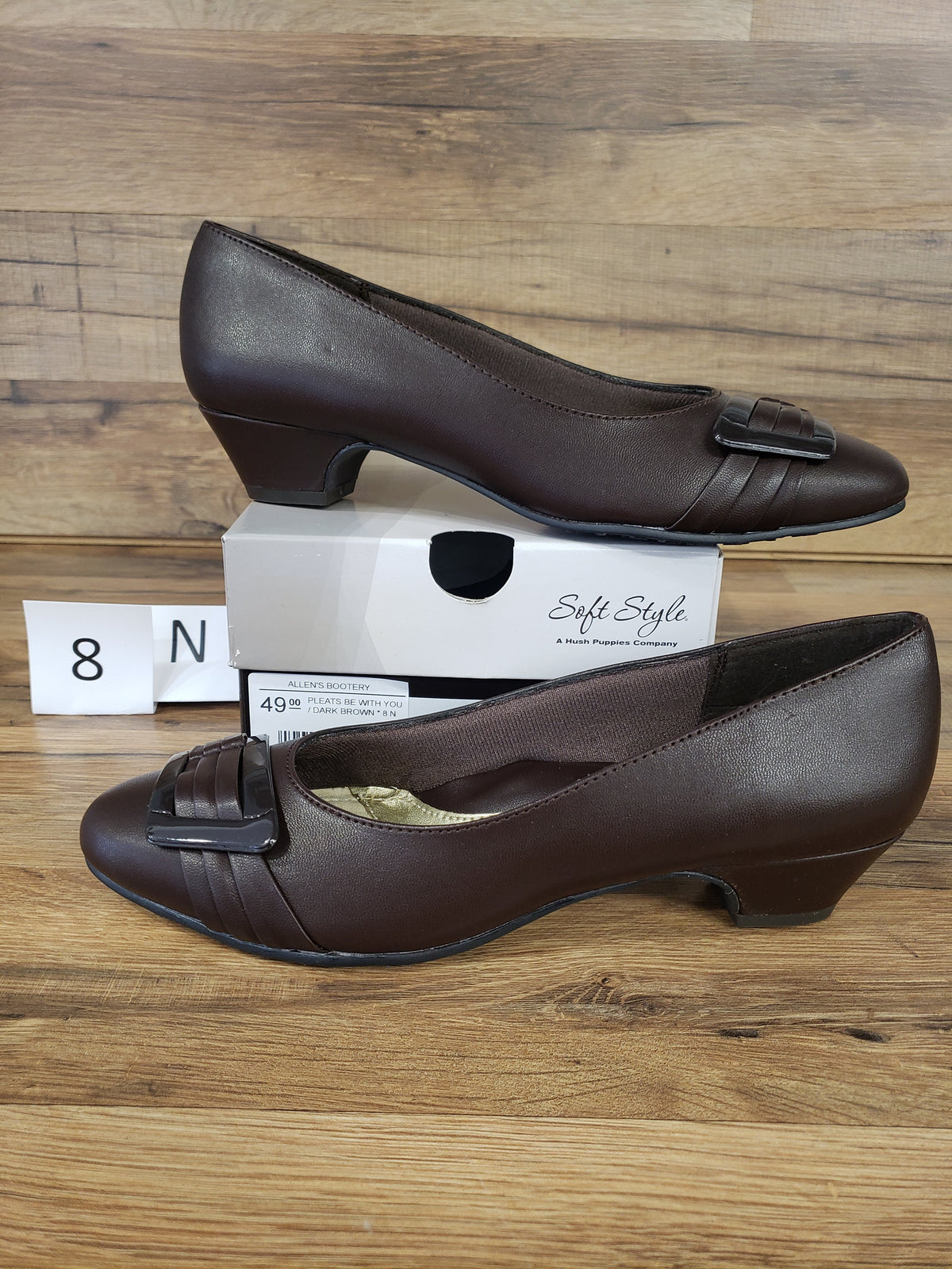 Allen's Bootery dark brown Pleats Be With You pumps featuring a round toe, pleated detail, and buckle ornament.