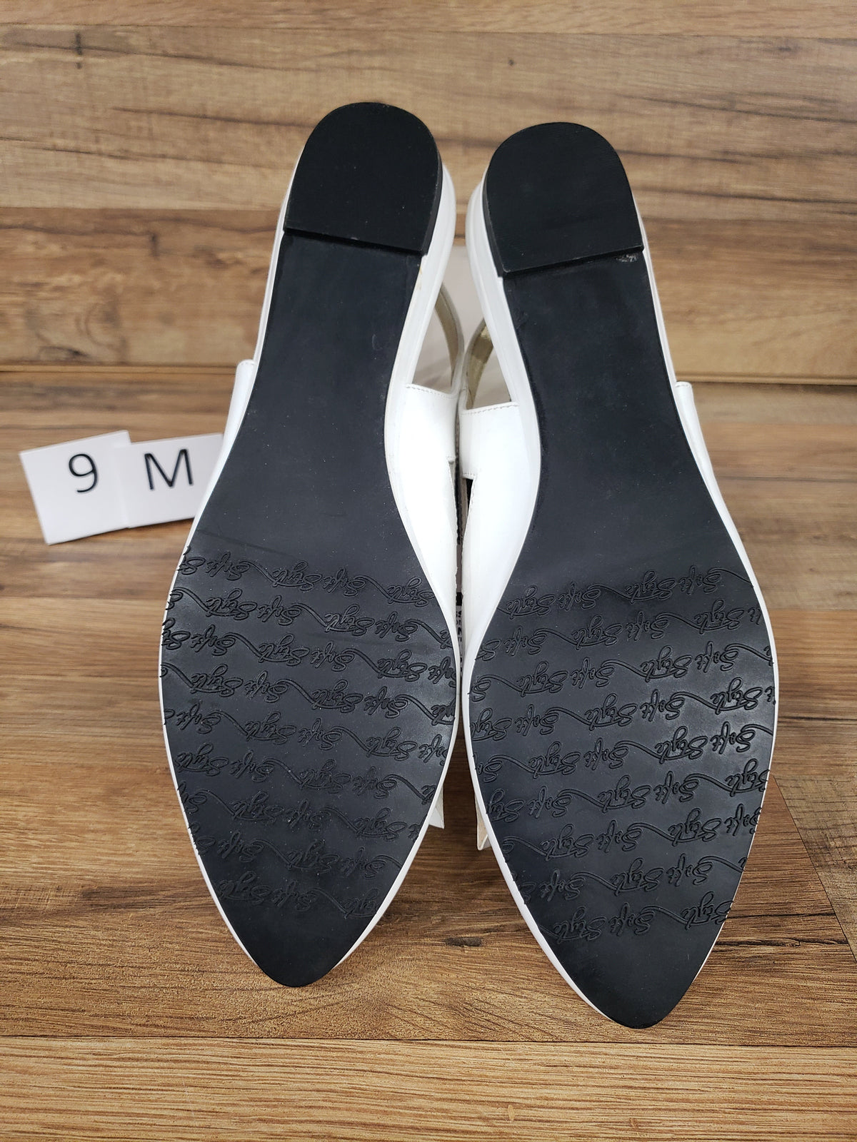 Allen's Bootery Soft Style by Hush Puppies Deni white patent slingback flats showing black textured outsoles