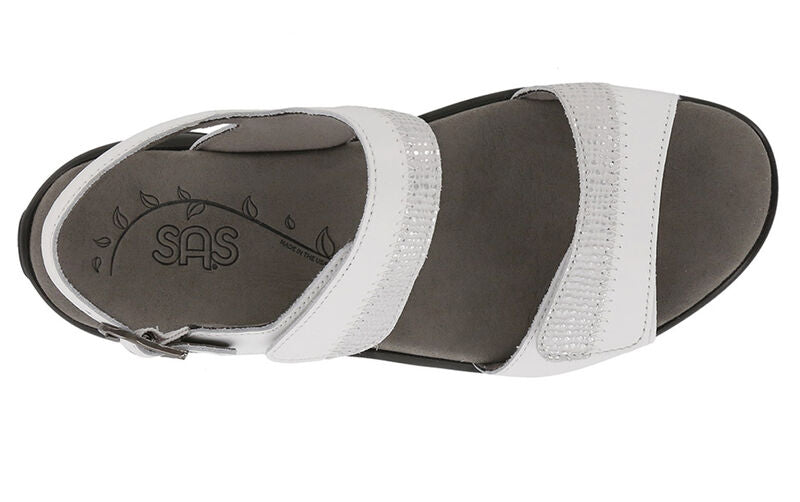 Allen's Bootery Nudu white leather sandals with decorative stitching, adjustable straps, and contoured grey footbed.