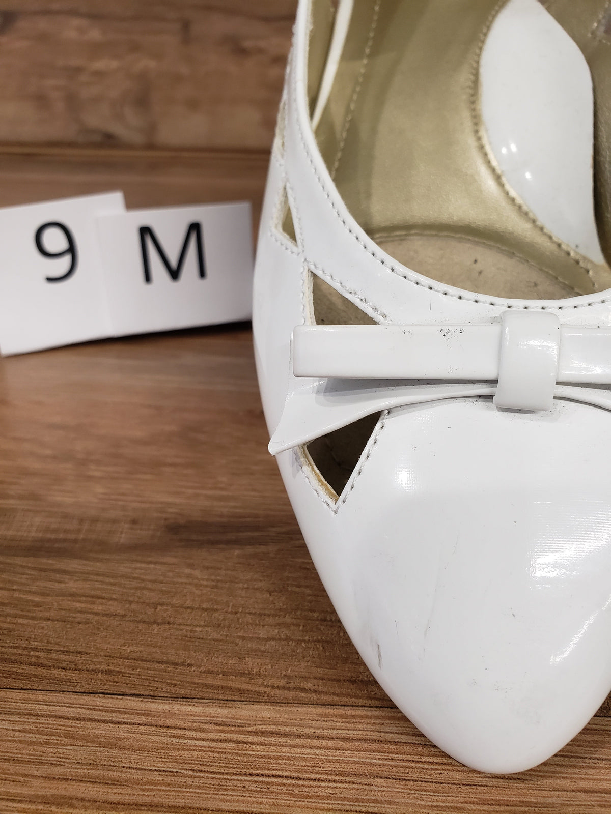 Allen's Bootery Soft Style by Hush Puppies Deni white patent slingback flats with a decorative bow detail