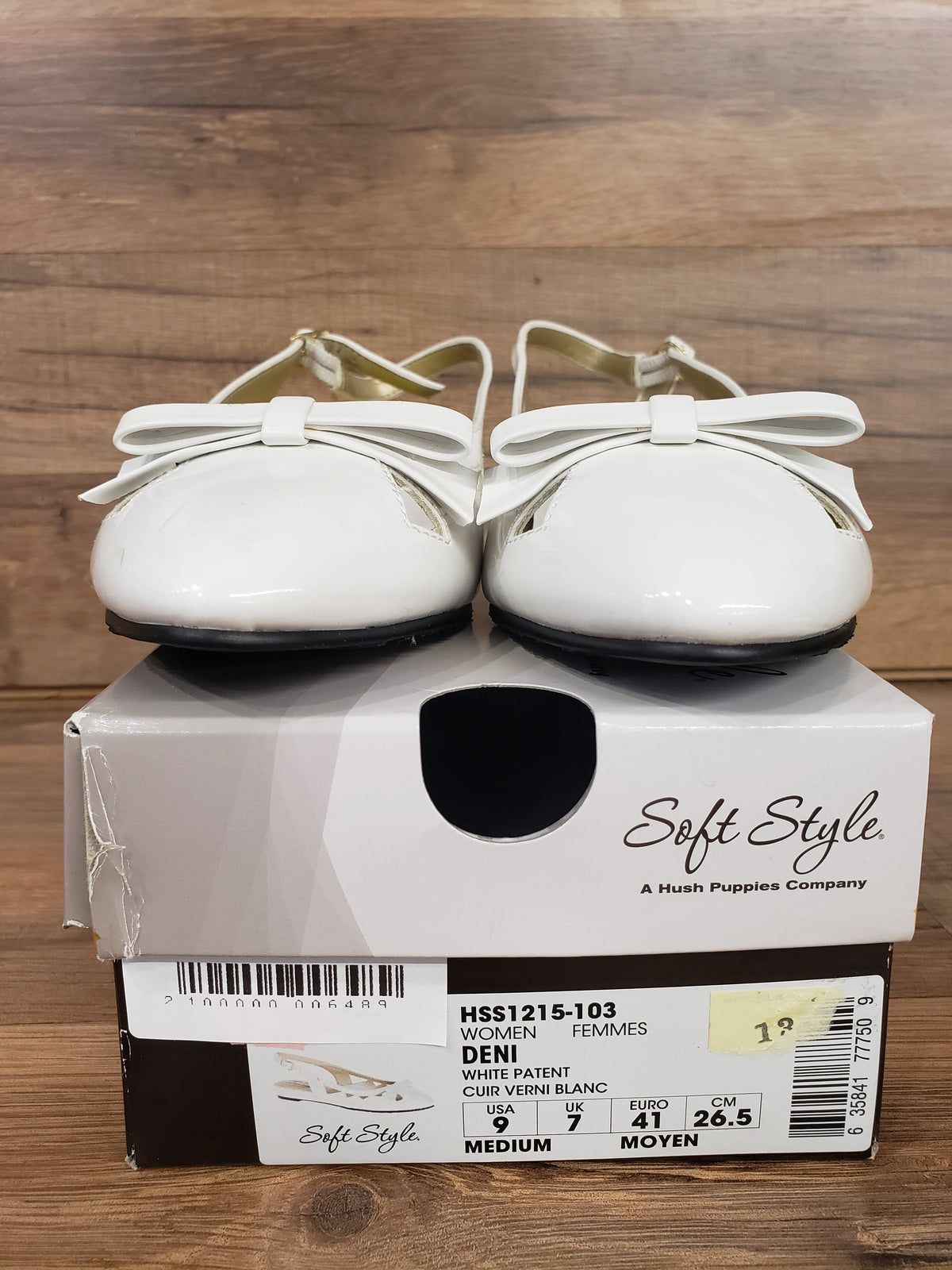 Allen's Bootery Soft Style by Hush Puppies Deni white patent leather slingback flats with bow detail on shoe box