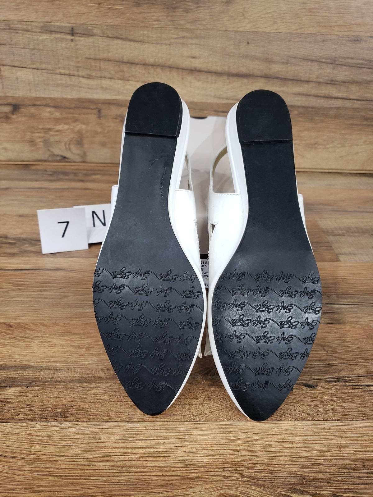 Allen's Bootery Soft Style by Hush Puppies Deni white patent slingback flats showing black textured outsoles