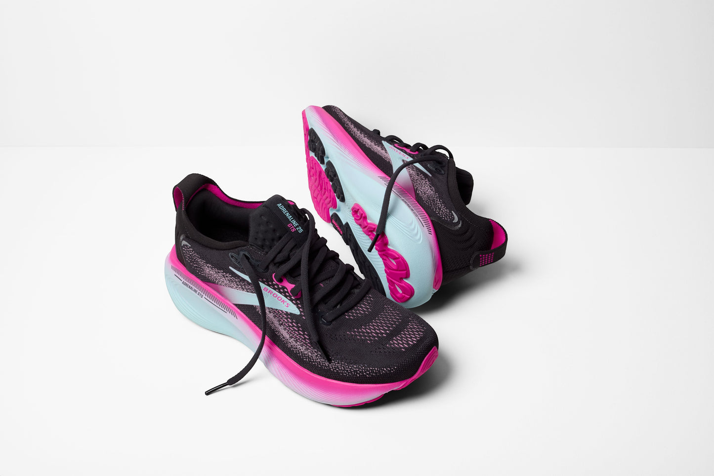 Allen's Bootery Women's Adrenaline GTS 25 running shoes in black with cyber pink and iced aqua accents. Features breathable mesh upper and supportive cushioning.