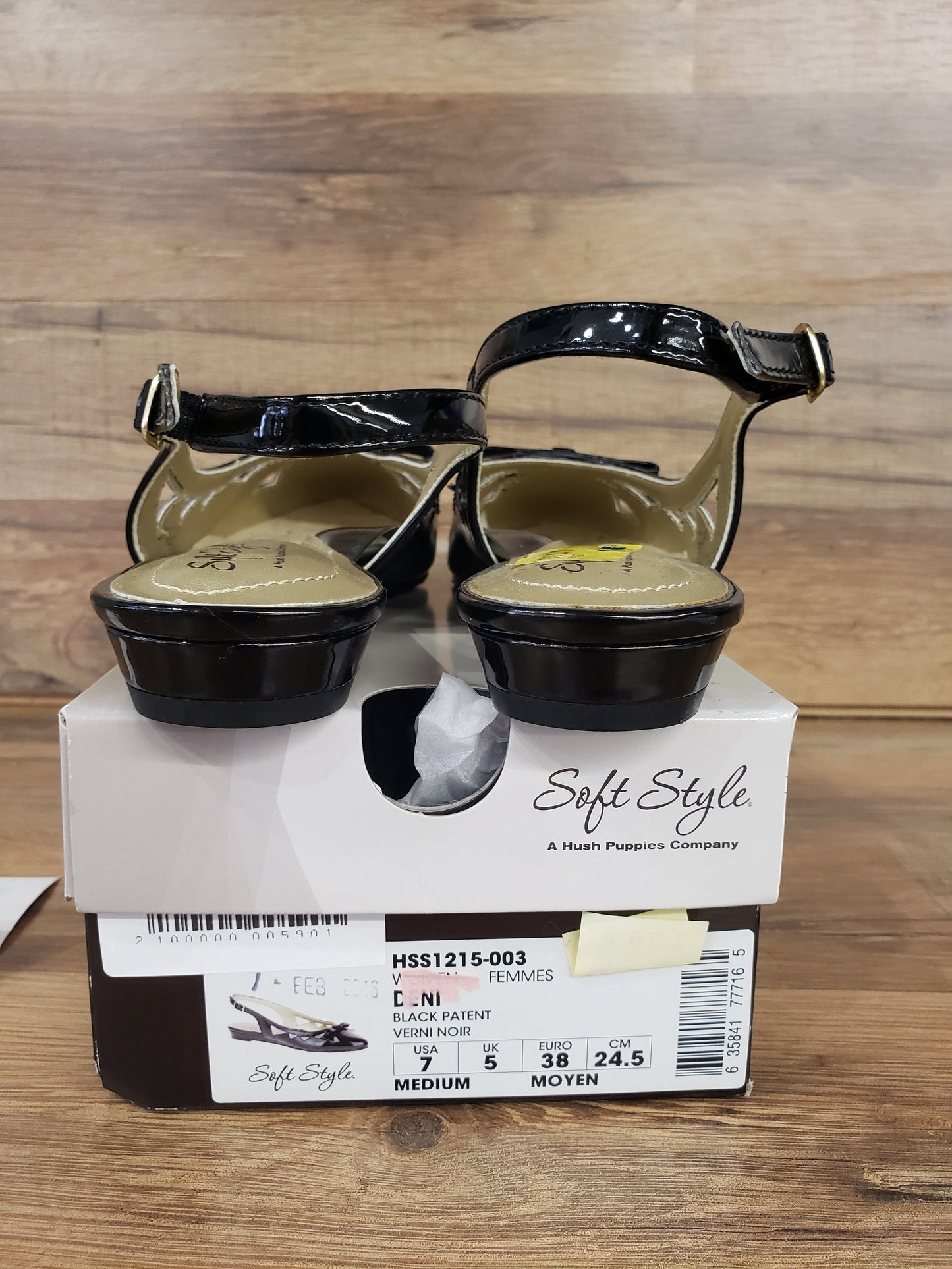 Allen's Bootery black patent leather flat dress shoes with buckle closure, shown from the back on a shoe box.