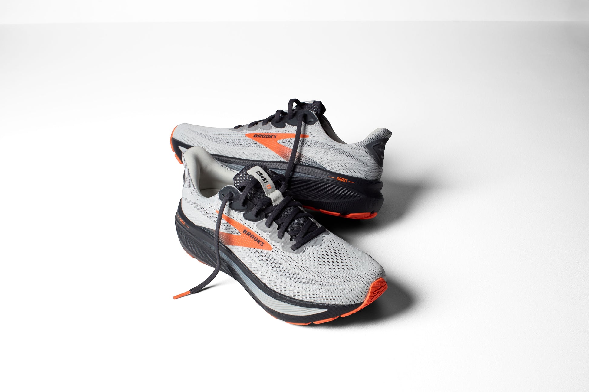 Allen's Bootery Brooks Ghost 17 neutral road running shoes in oyster mushroom, orange, and ebony with mesh upper.