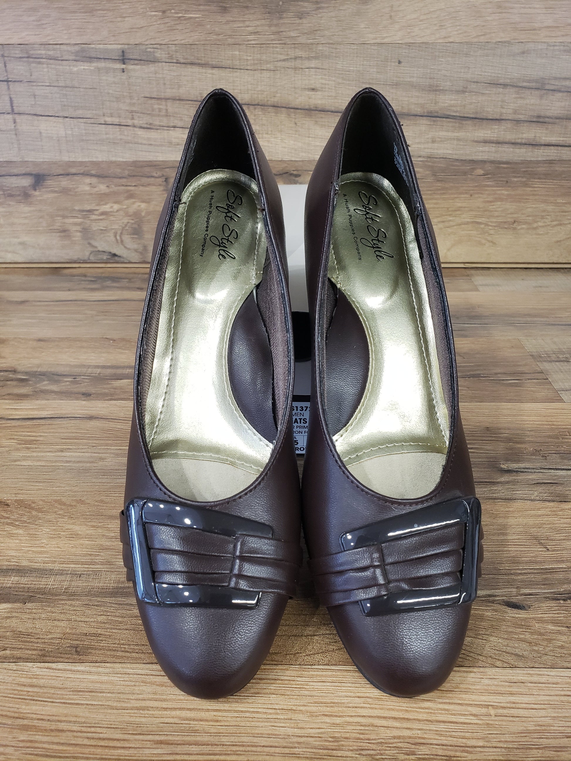Allen's Bootery dark brown closed-toe pumps with pleated toe detail, buckle ornament, and memory foam footbed.