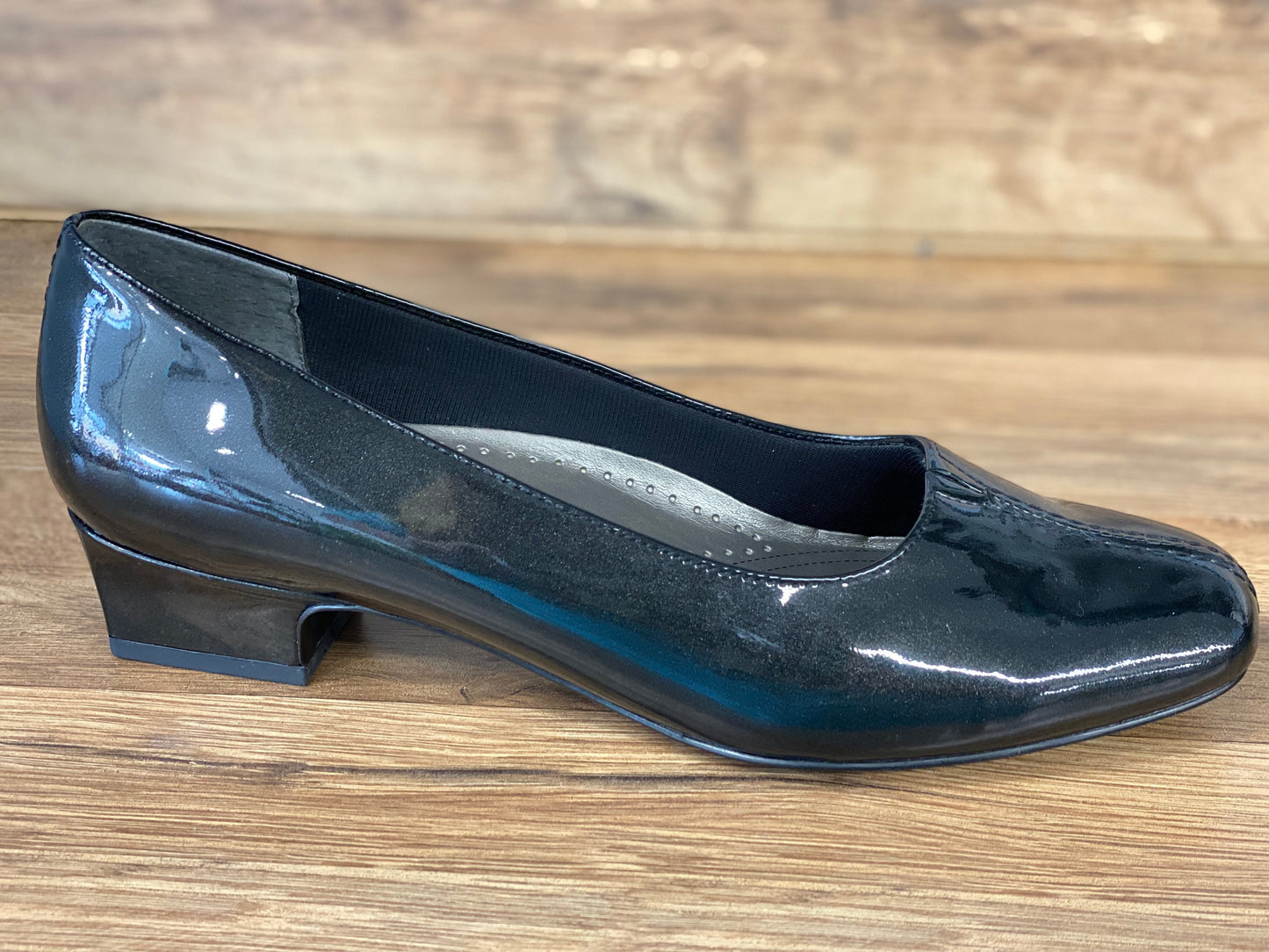 Allen's Bootery Doris black pearl patent leather low heel pump with a v-gore center and cushioned footbed.