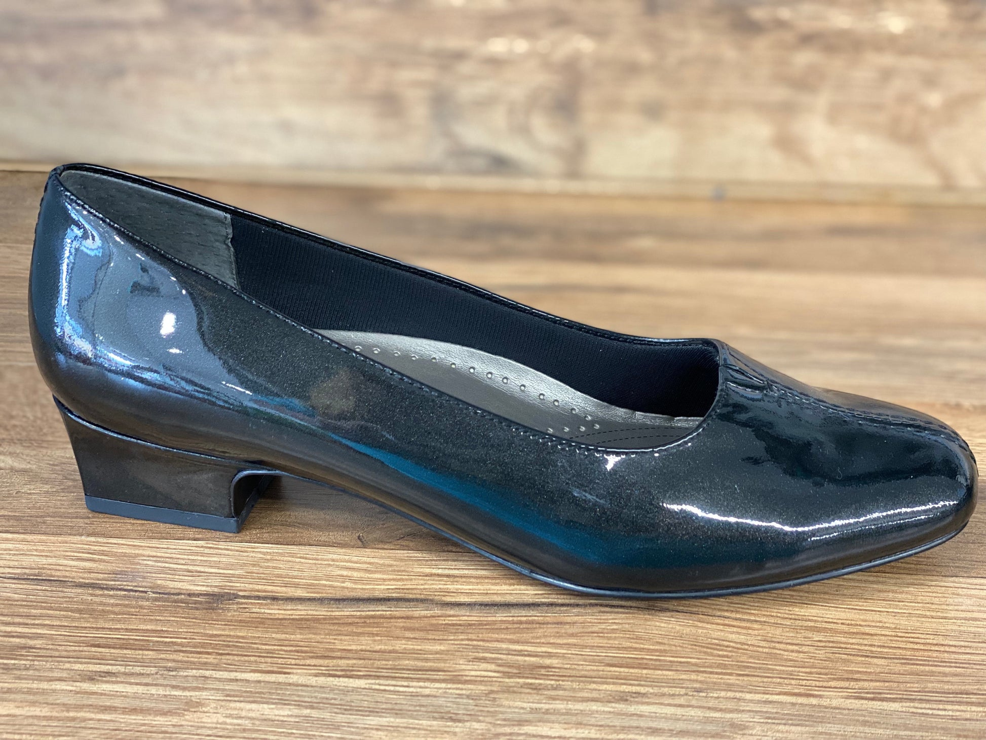Allen's Bootery Doris black pearl patent leather low heel pump with a v-gore center and cushioned footbed.