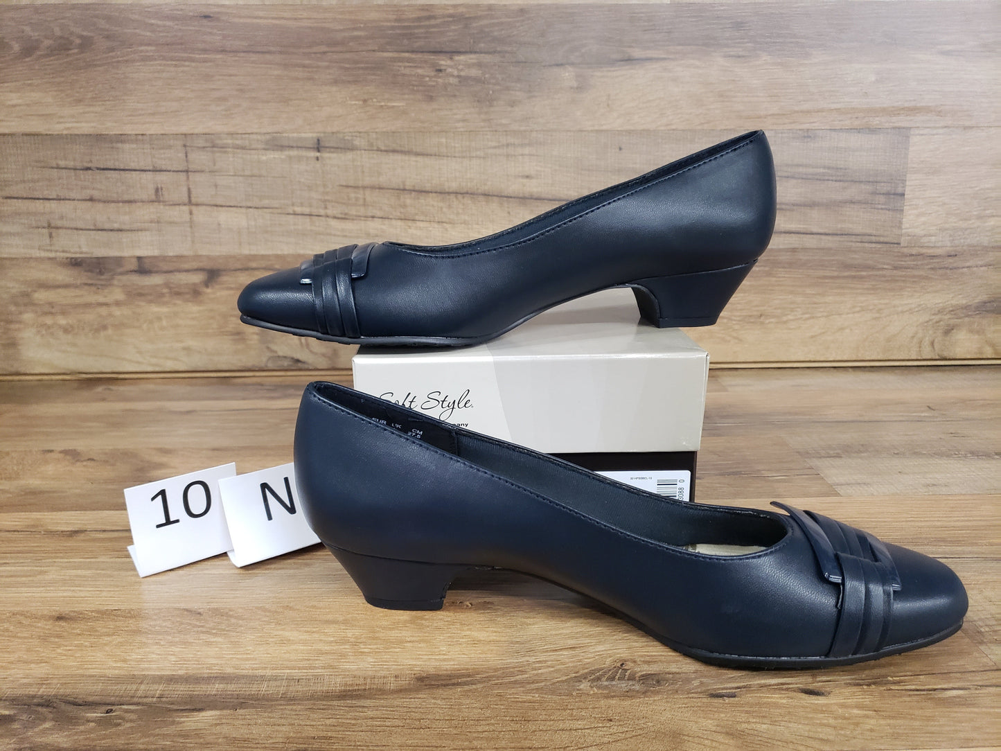 Allen's Bootery navy blue closed-toe pumps with pleated toe detail, buckle accent, and low block heel