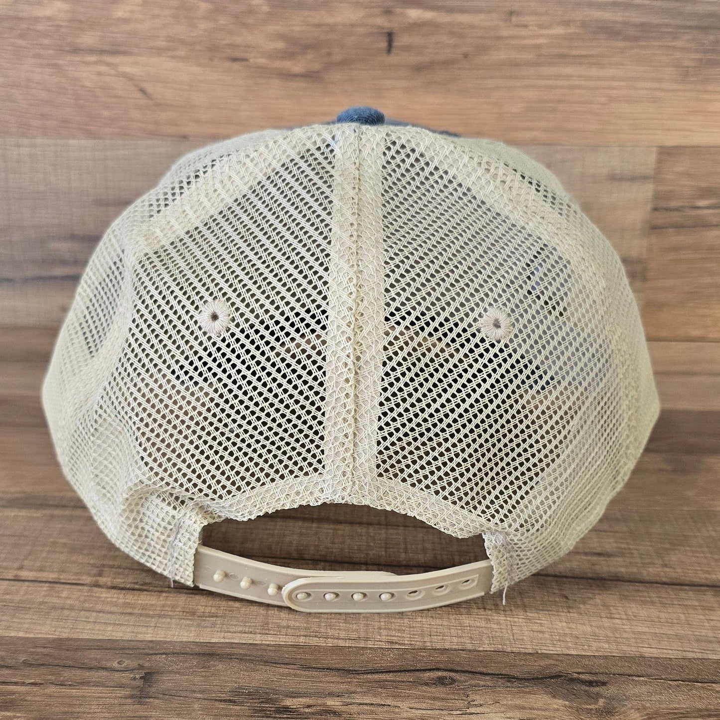 Allen's Bootery Mountain Mama trucker hat featuring a beige breathable mesh back and adjustable snapback closure