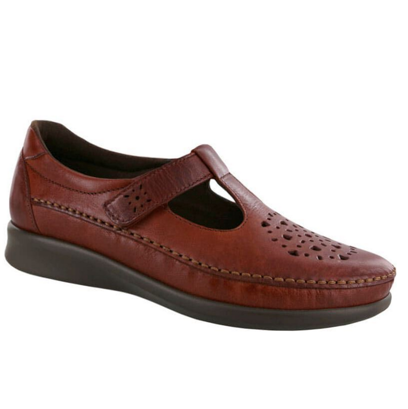 Allen's Bootery Willow walnut leather moccasin with cutout pattern, adjustable strap, and cushioned sole.