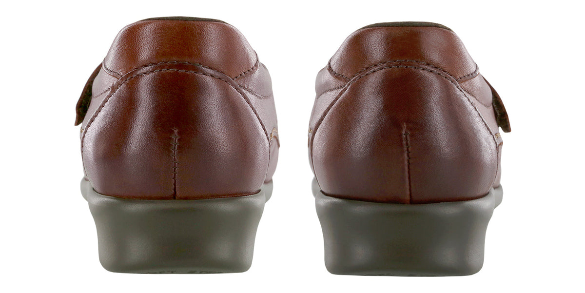 Allen's Bootery Willow walnut leather moccasins showing the back view of the cushioned heels and adjustable straps.
