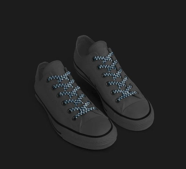 Allen's Bootery Xpand Laces Original no-tie elastic laces in true blue with reflective detailing on canvas sneakers.