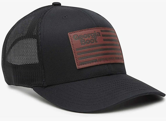 Allen's Bootery black trucker hat with mesh back and a leather patch featuring a distressed American flag and Georgia Boot logo.