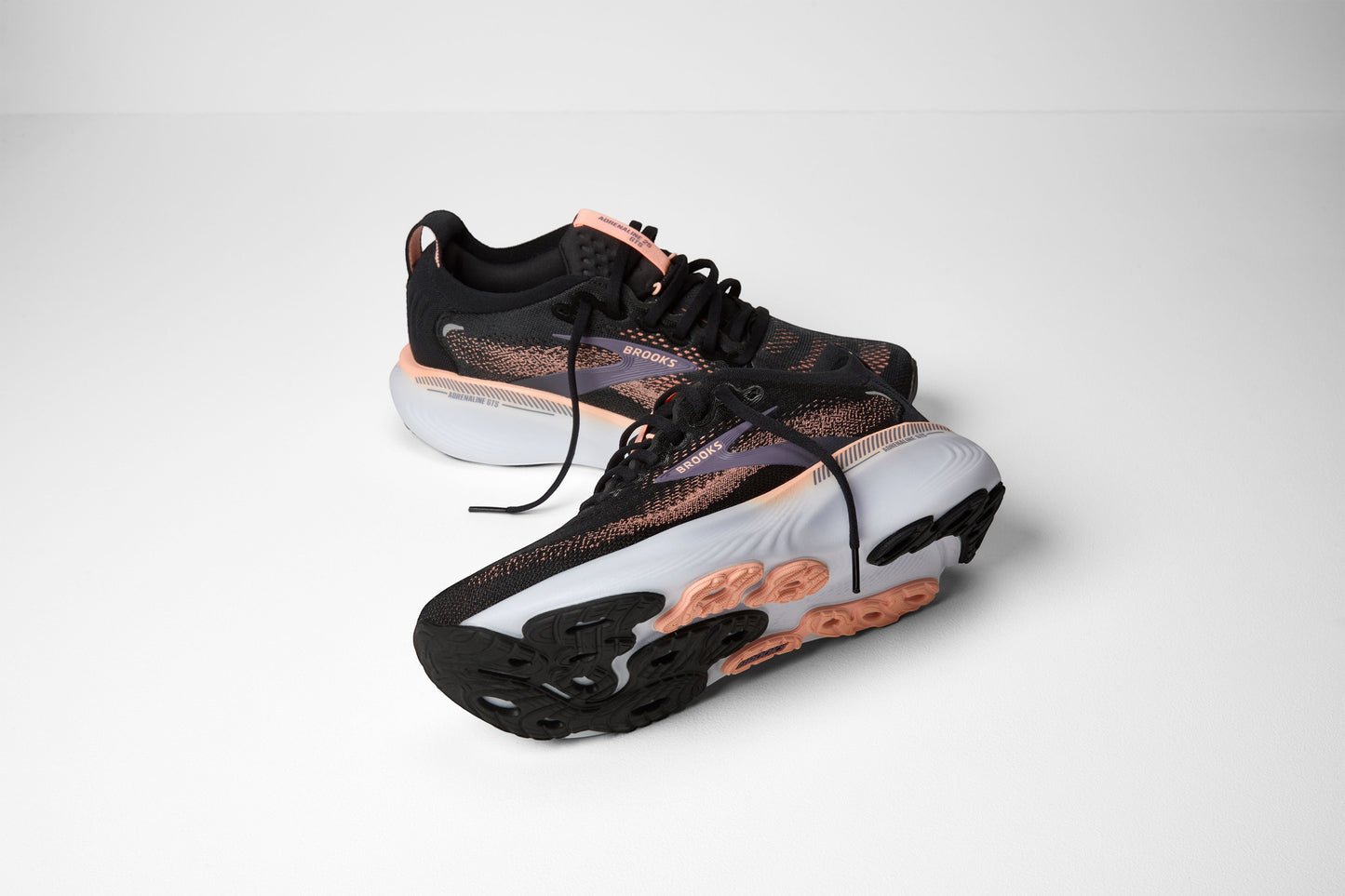 Allen's Bootery Brooks Adrenaline 25 women's running shoe in black, peach, and mulled grape with a cushioned sole.