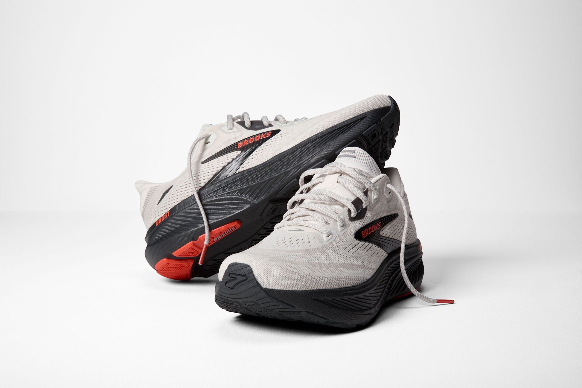 Allen's Bootery Brooks Ghost 18 men's road running shoes in coconut, pearl, and tigerlily with a black rubber outsole.