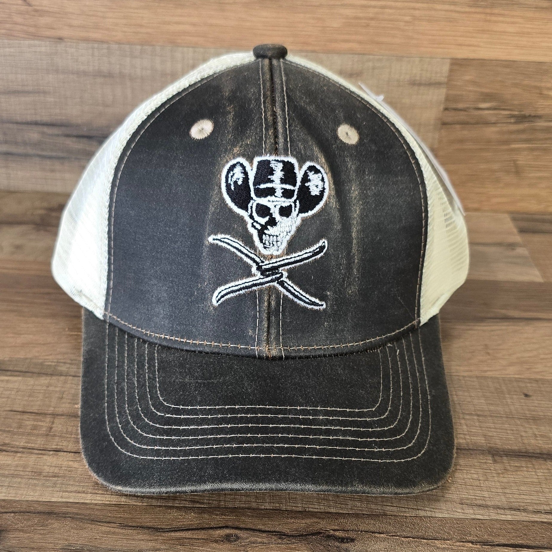 Allen's Bootery brown distressed mesh hat featuring a white embroidered skull and cowboy hat logo on the front.