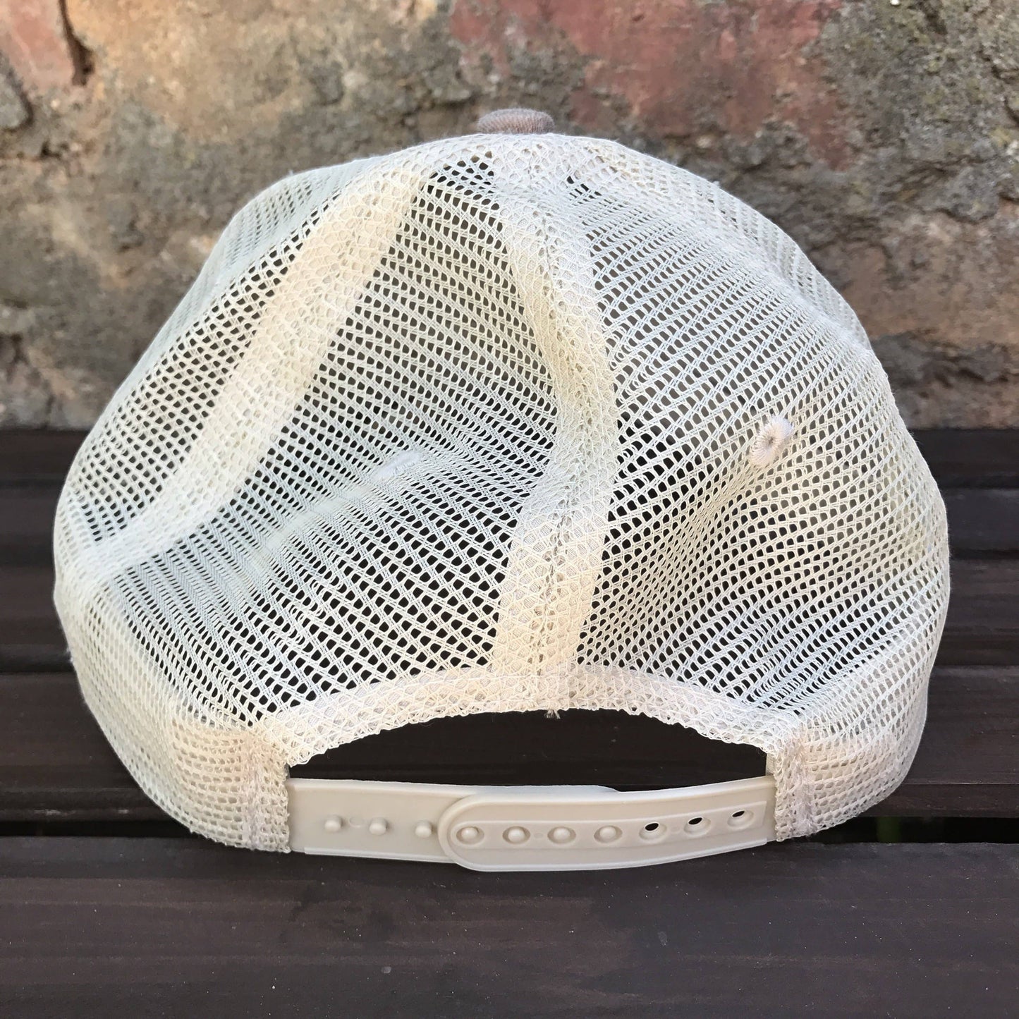 Allen's Bootery distressed brown trucker hat with a white mesh back and adjustable snapback closure