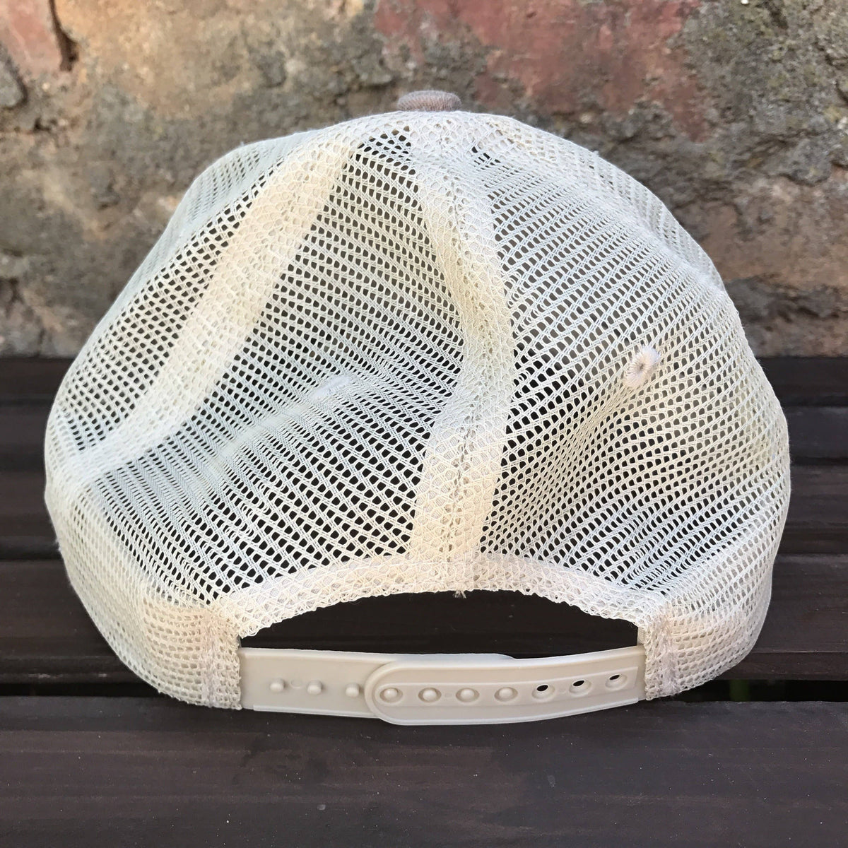 Allen's Bootery distressed brown trucker hat with a white mesh back and adjustable snapback closure