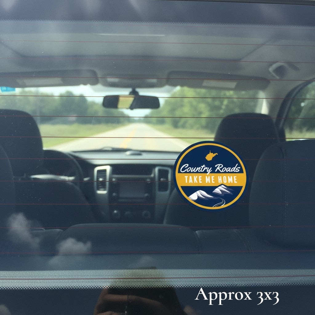 Allen's Bootery Country Roads circular sticker with mountain graphic applied to a car rear window