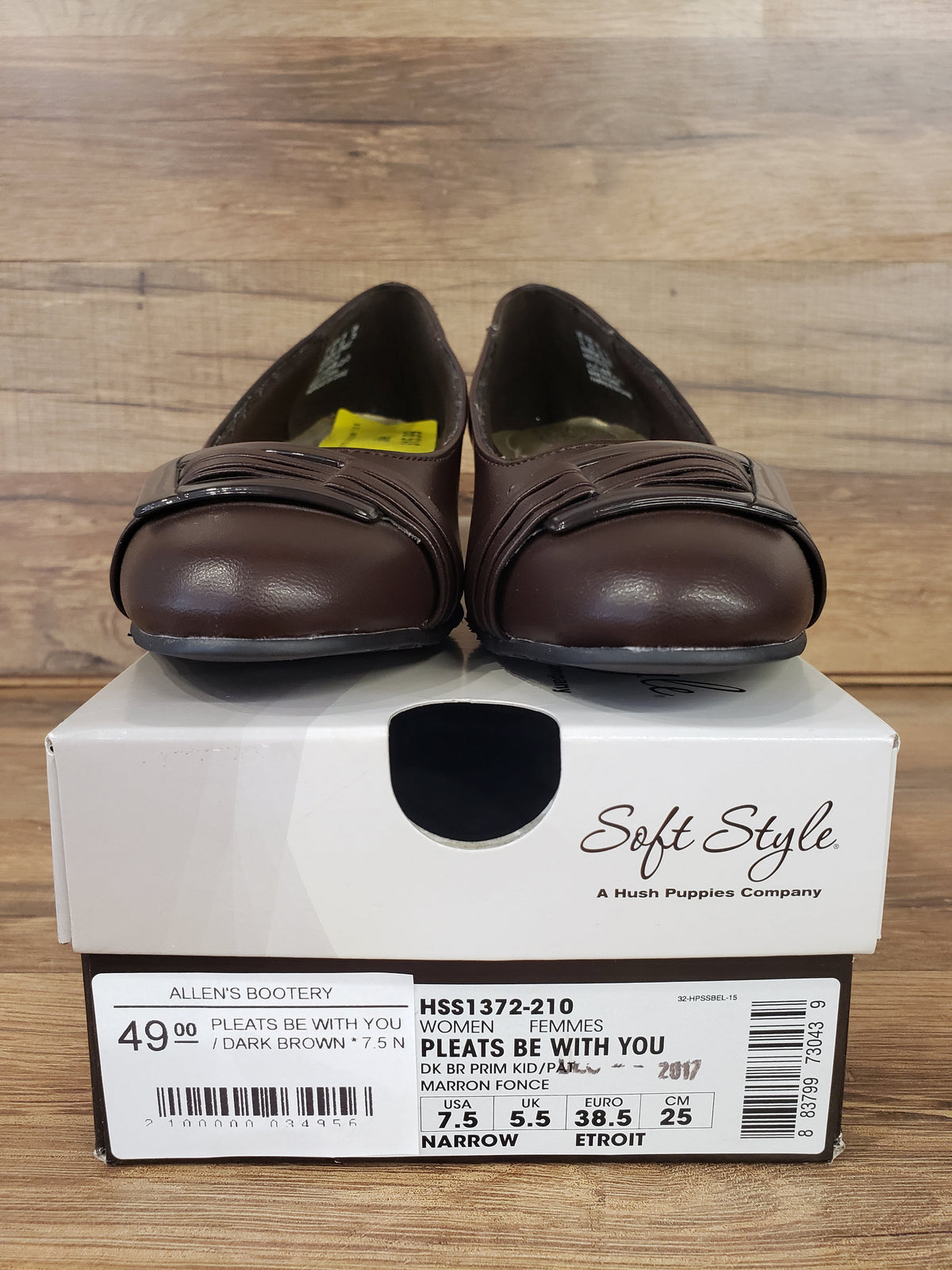 Allen's Bootery dark brown Pleats Be With You pumps with a rounded toe, pleated detail, and buckle on the toe box.