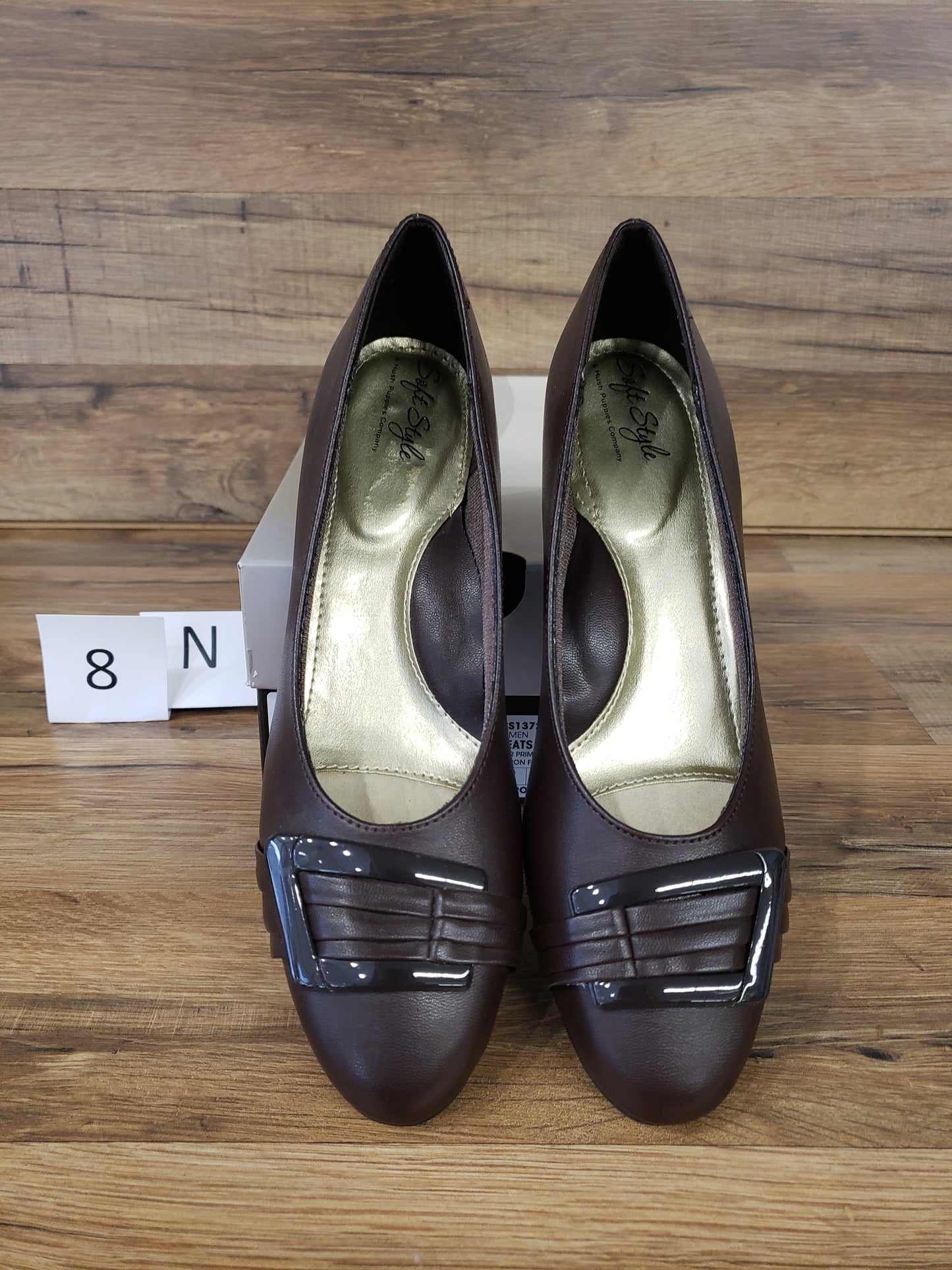 Allen's Bootery dark brown closed-toe pumps with a pleated buckle detail, rounded toe, and memory foam footbed.