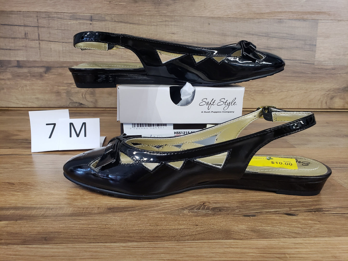 Allen's Bootery Deni black patent leather slingback flat dress shoes with cutout details and buckle closure.