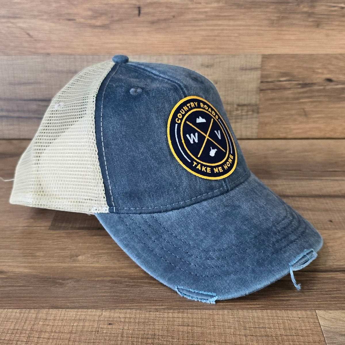 Allen's Bootery distressed blue trucker hat with a mesh back and a circular West Virginia Country Roads patch.