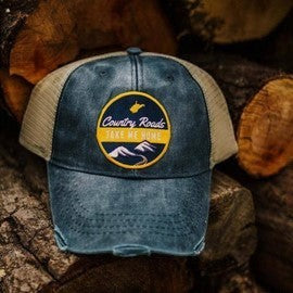 Allen's Bootery distressed blue denim trucker hat with tan mesh back and Country Roads mountain landscape patch