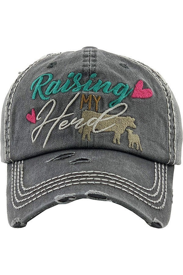 Allen's Bootery distressed grey baseball cap with Raising My Herd embroidery, cow and calf graphic, and pink hearts.