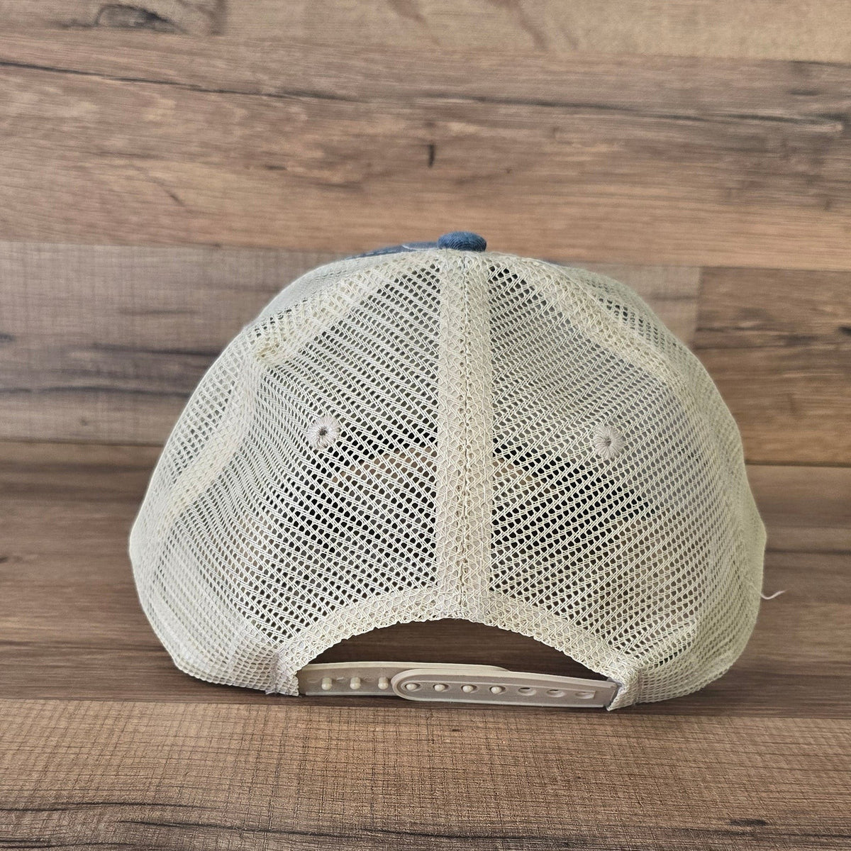Allen's Bootery distressed brown trucker hat with a white mesh back and adjustable snapback closure