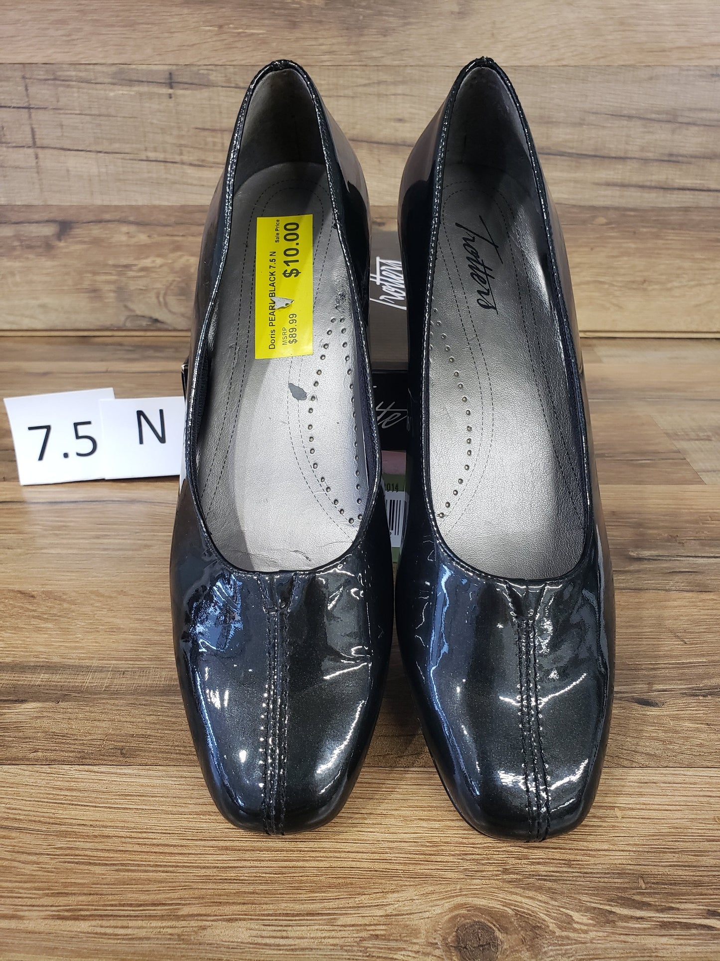 Allen's Bootery Doris black pearl patent leather pumps with a low heel and v-gore center vamp detail.