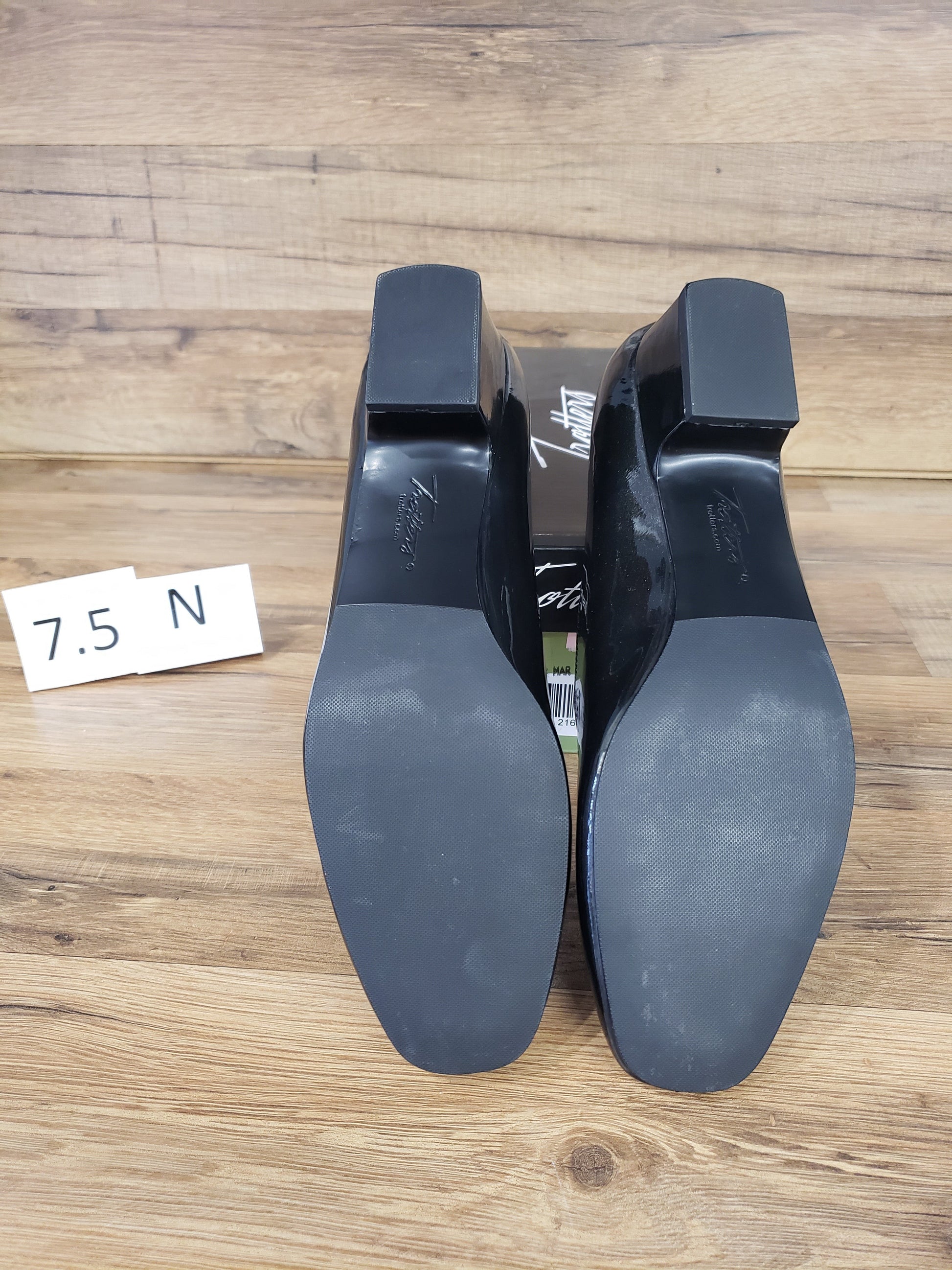 Allen's Bootery Doris black pearl patent leather pumps showing the synthetic rubber soles and low block heels