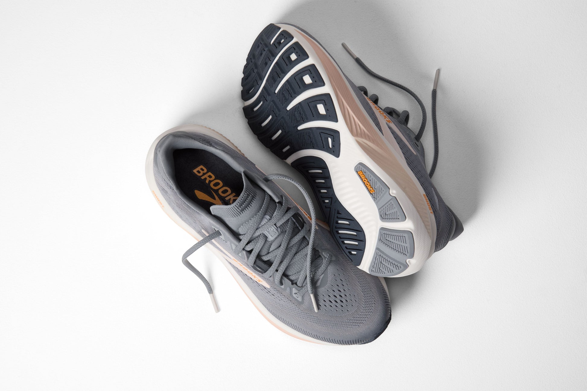 Allen's Bootery women's Ghost 18 road-running shoes in grey, morganite, and coconut with a durable rubber outsole.
