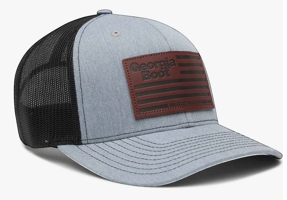 Allen's Bootery grey and black trucker hat with a square leather Georgia Boot flag patch and mesh back.