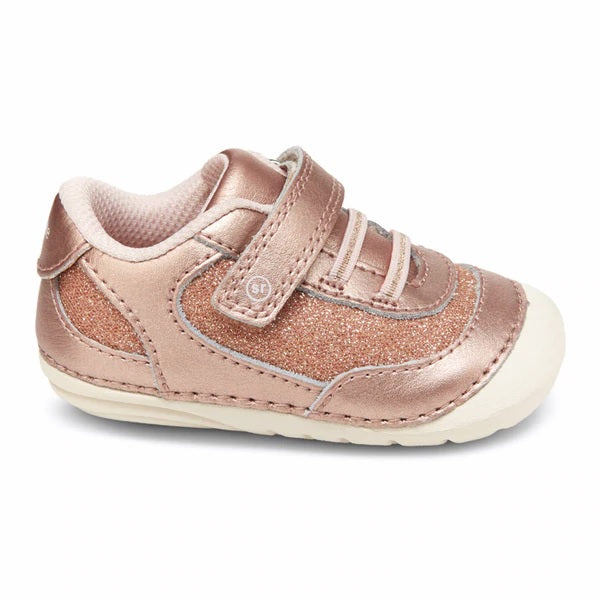 Allen's Bootery Jazzy infant sneaker in rose gold glitter with hook and loop closure and rounded edges for stability.