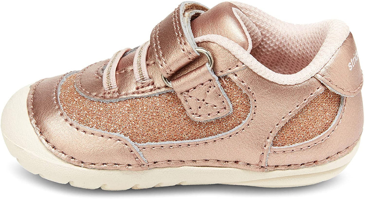 Allen's Bootery Jazzy rose gold metallic infant sneaker with hook and loop closure and rounded edges for stability.