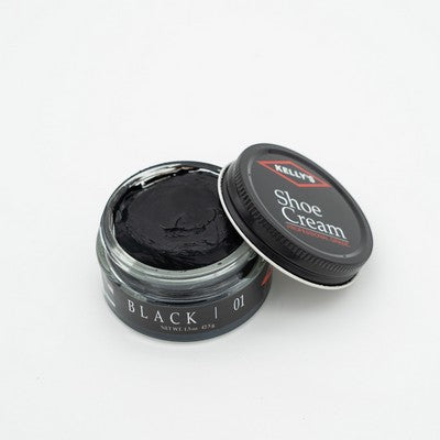 Allen's Bootery Kelly's black leather shoe cream in an open glass jar with a black lid for conditioning and polishing.