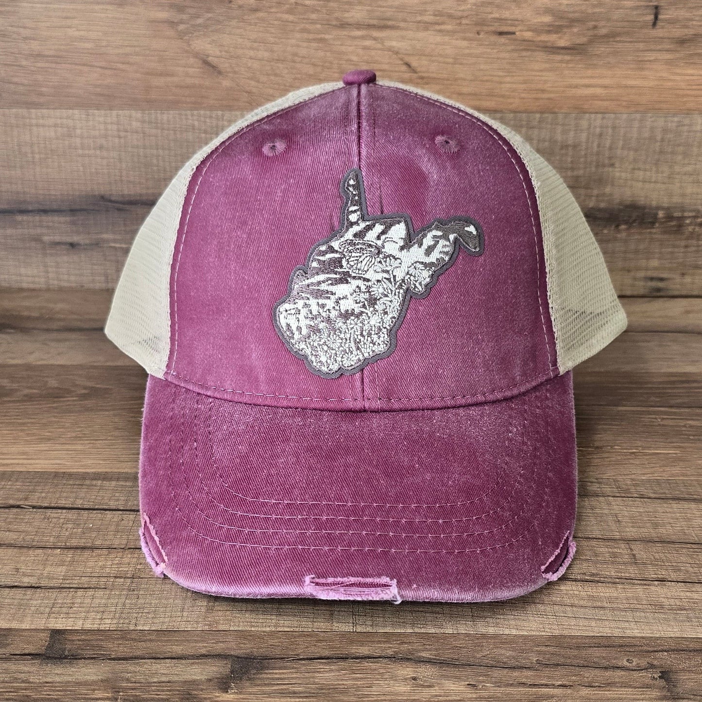 Allen's Bootery distressed maroon trucker hat with a mesh back and a West Virginia state patch on the front.