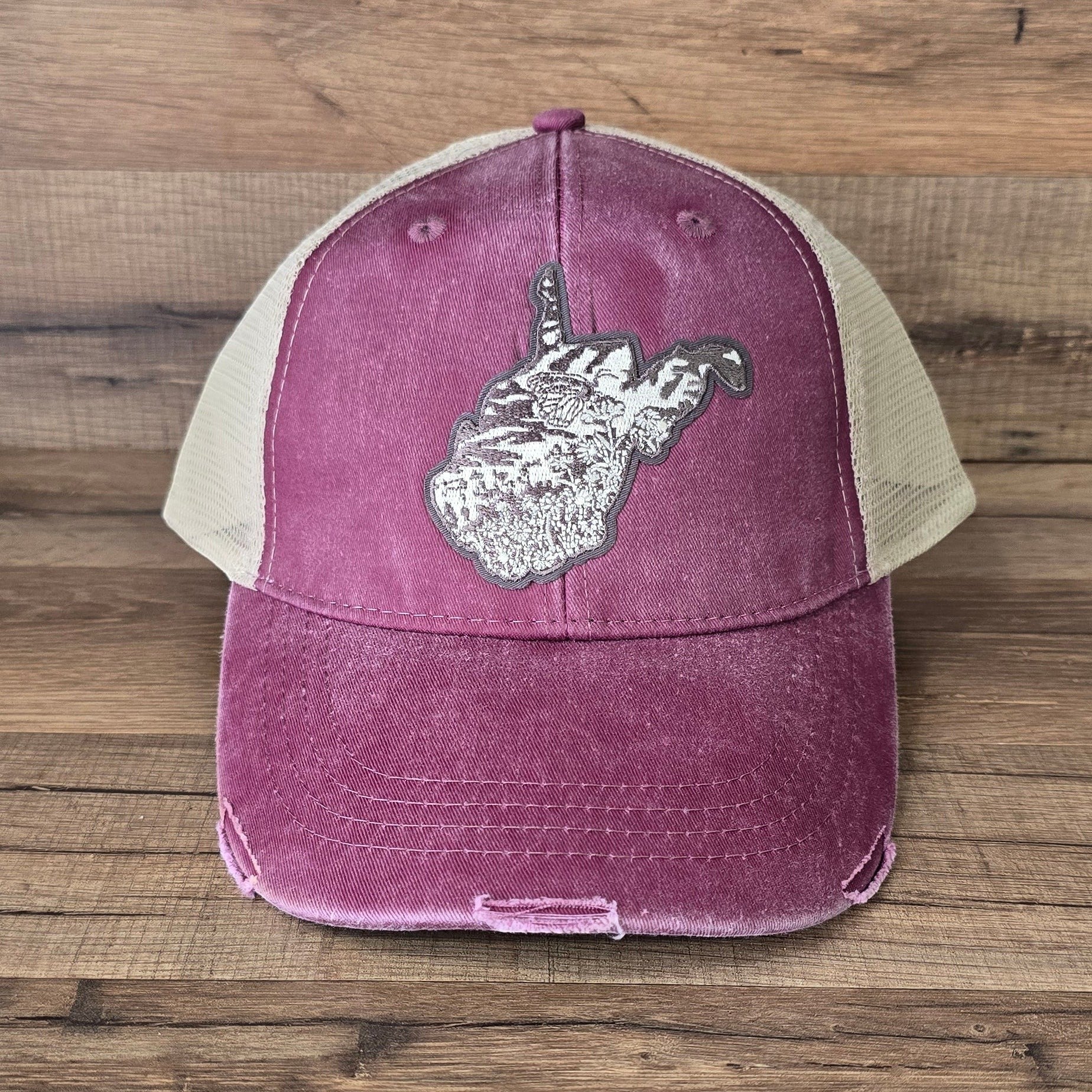 Allen's Bootery distressed maroon trucker hat with a mesh back and a West Virginia state patch on the front.