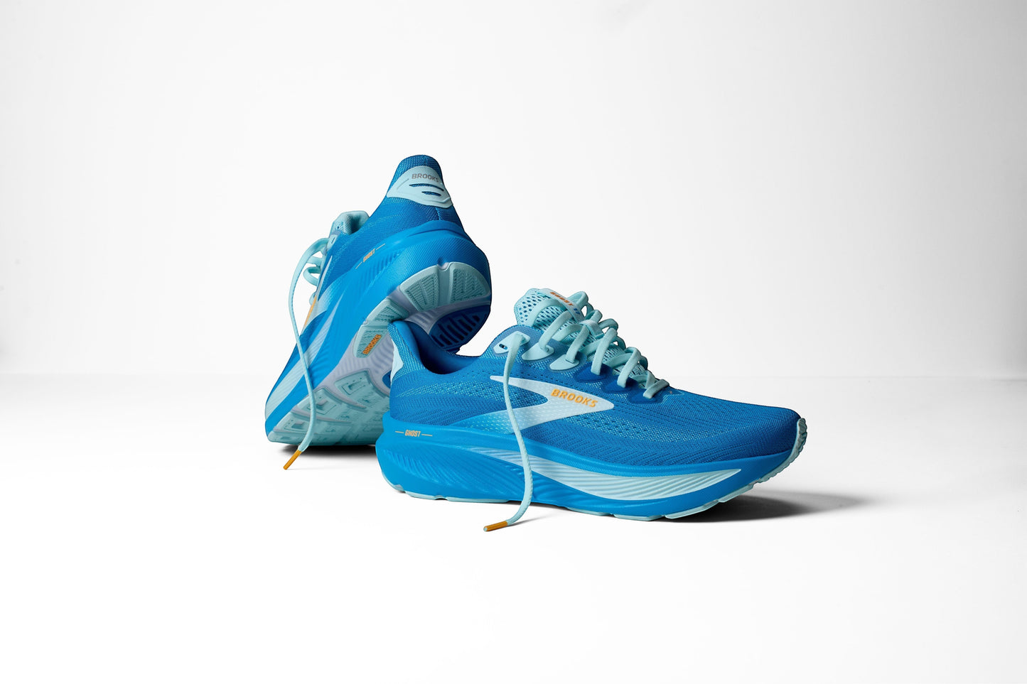 Allen's Bootery Men's Ghost 17 running shoes in blue with orange accents. Features recycled materials and enhanced cushioning.