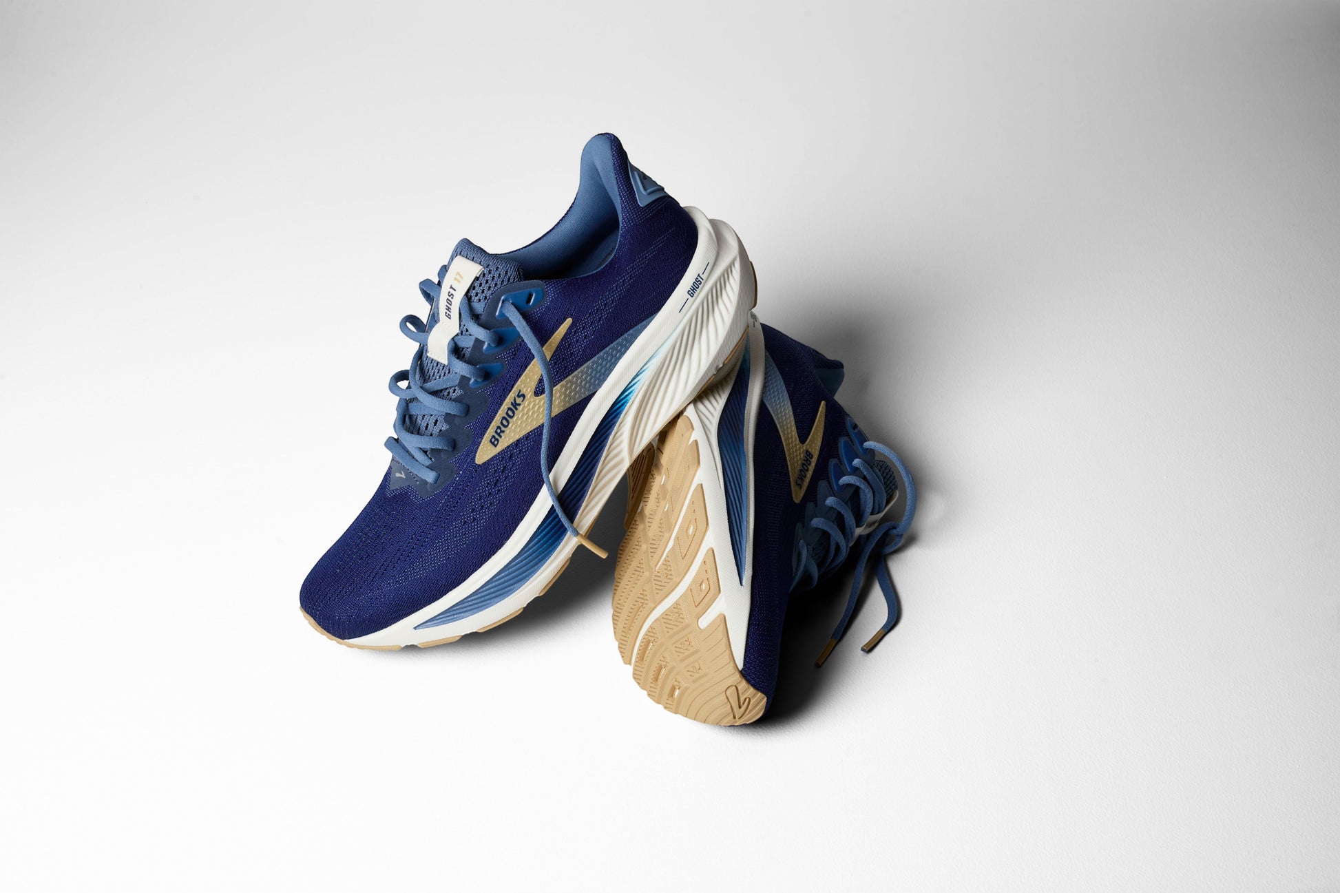 Allen's Bootery Men's Ghost 17 running shoes in blue with gold accents. Features increased cushioning and recycled materials.
