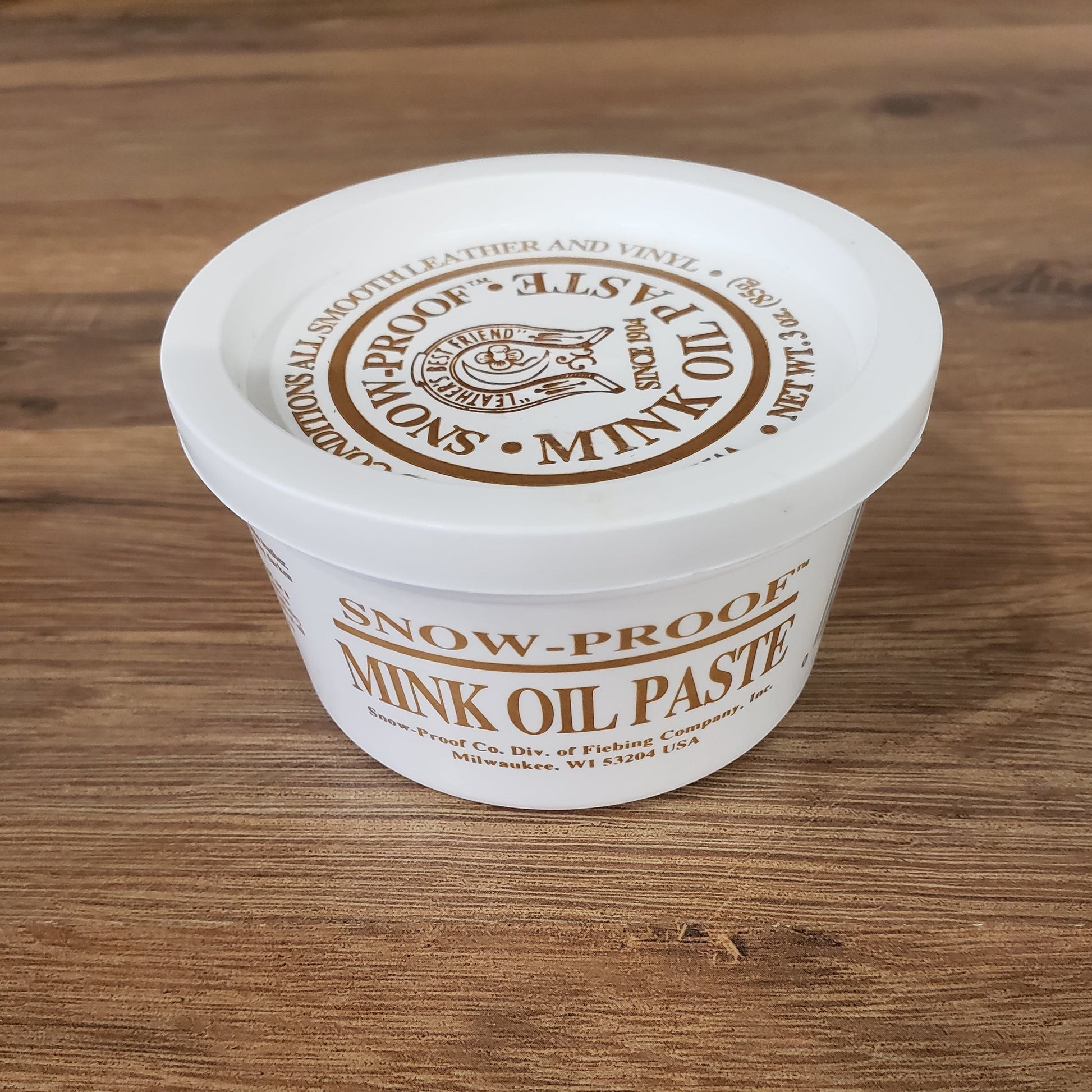 Allen's Bootery Snow-Proof Mink Oil Paste in a white plastic container for conditioning and protecting leather boots.
