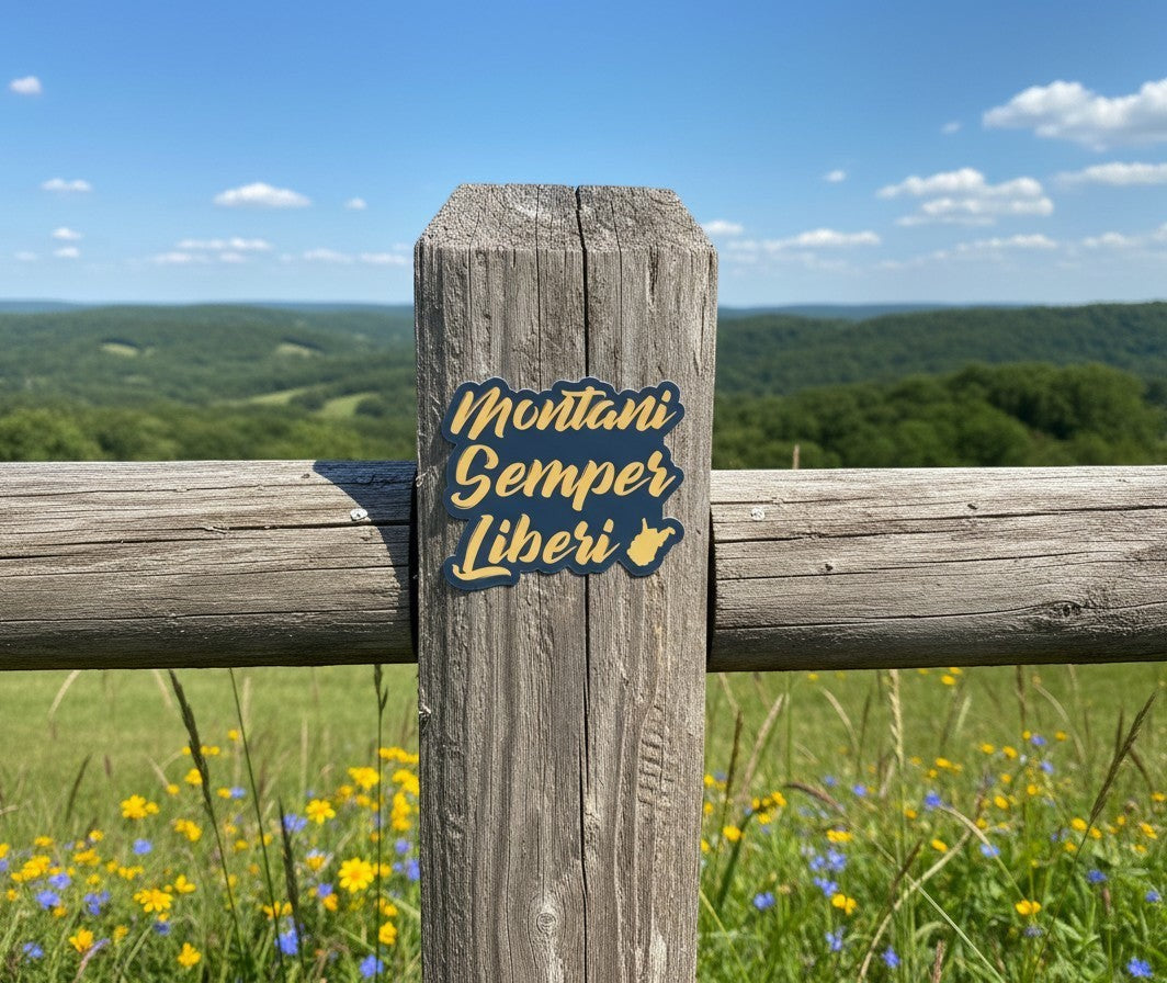 Allen's Bootery Montani Semper Liberi sticker with yellow cursive text and West Virginia outline on a wooden post.