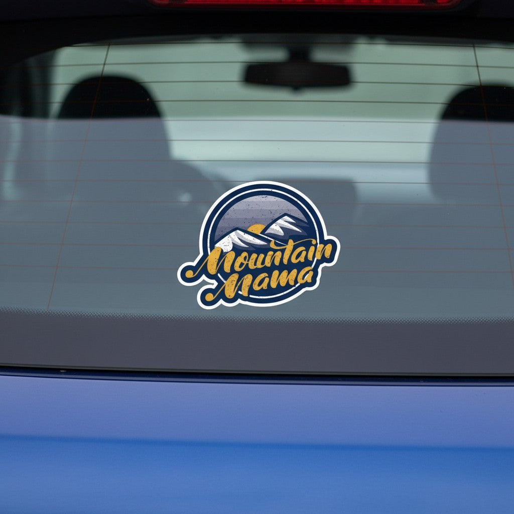 Allen's Bootery Mountain Mama vinyl sticker with mountain landscape and golden script on a blue car window