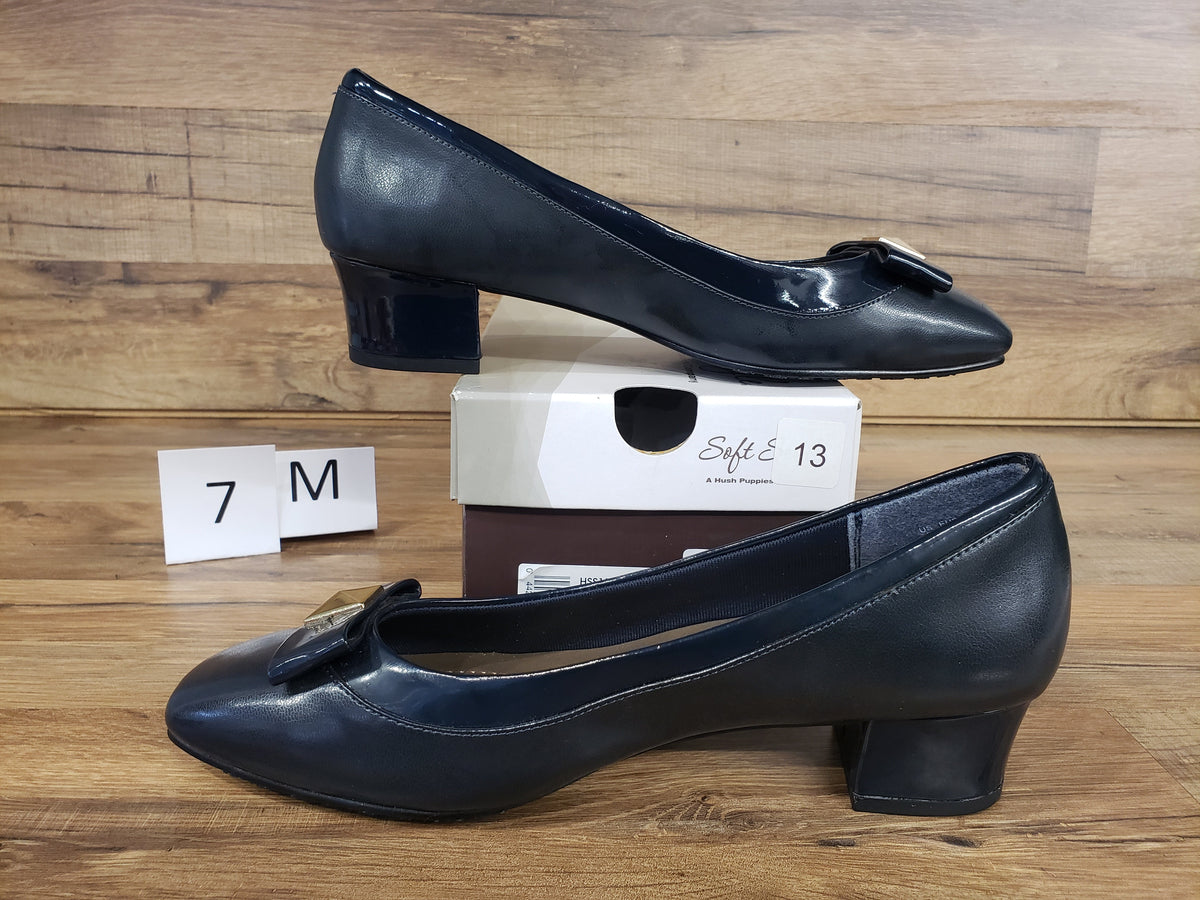 Allen's Bootery navy cap toe pumps with metal ornament and low block heel, featuring Soft Delight comfort system.