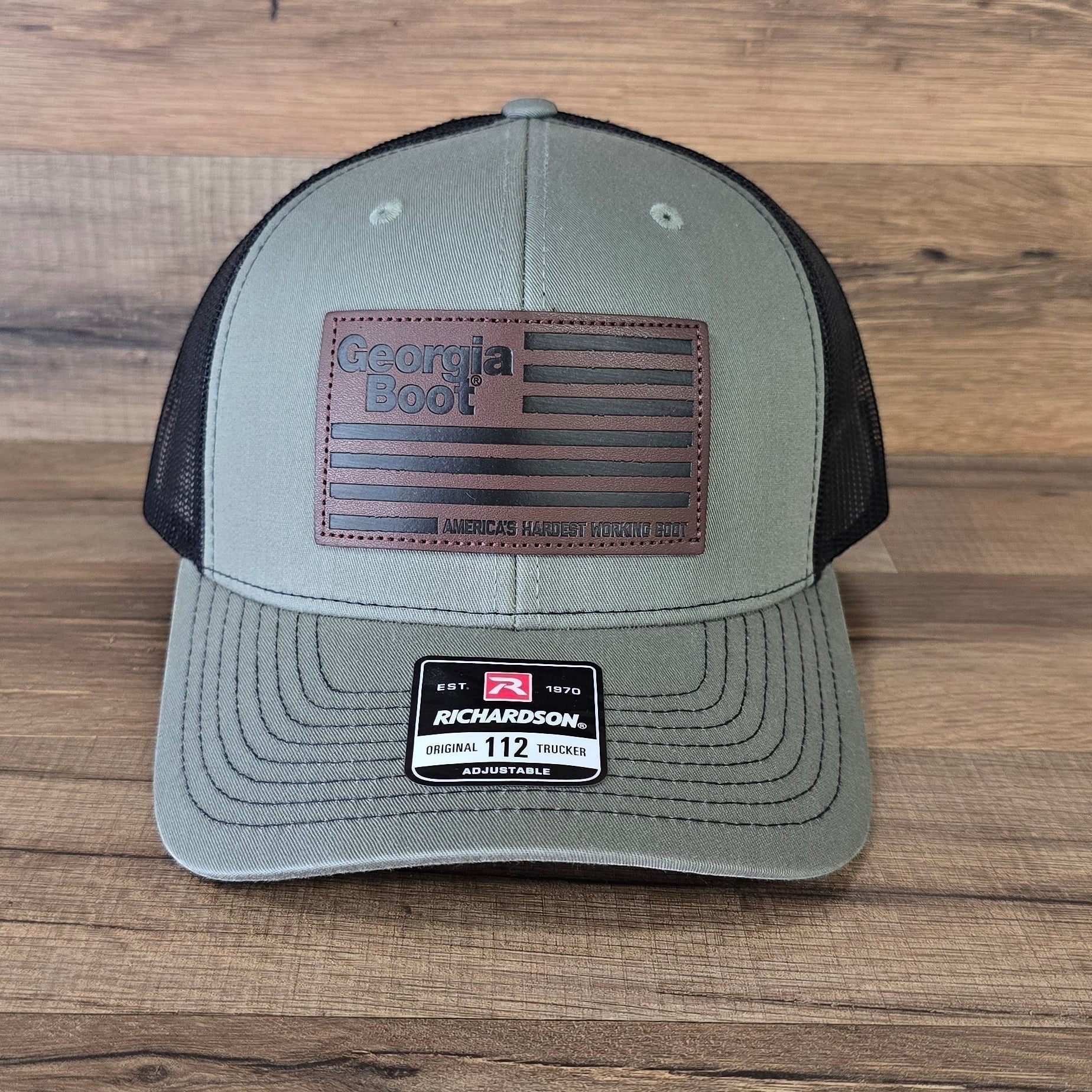 Allen's Bootery olive green and black Richardson 112 trucker hat with a leather Georgia Boot flag patch.