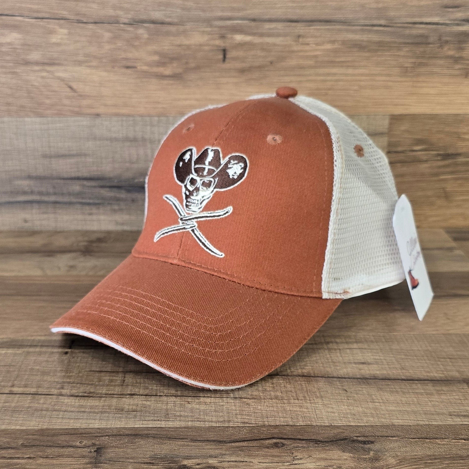 Allen's Bootery orange and white trucker hat with embroidered skull and cowboy hat graphic on cotton-twill front.